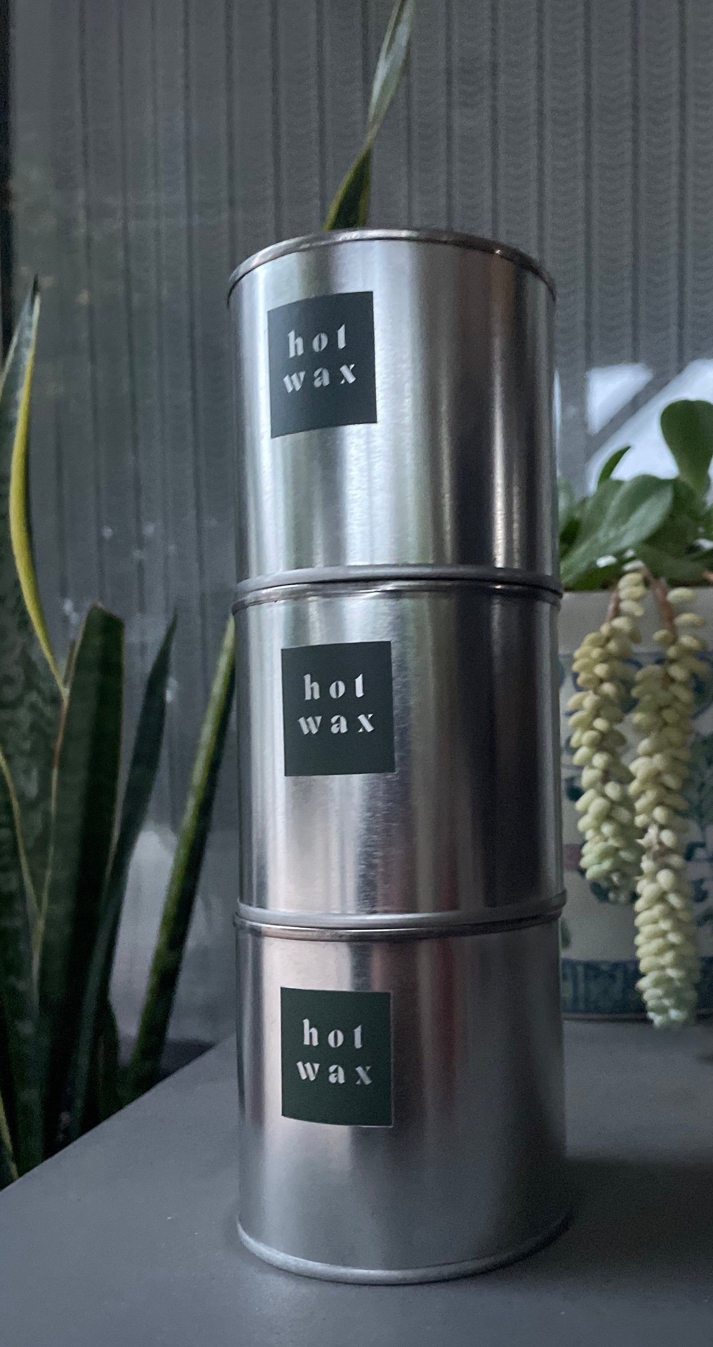 Day One Collection by HOT WAX, three stacked steel tin candles with logo labels